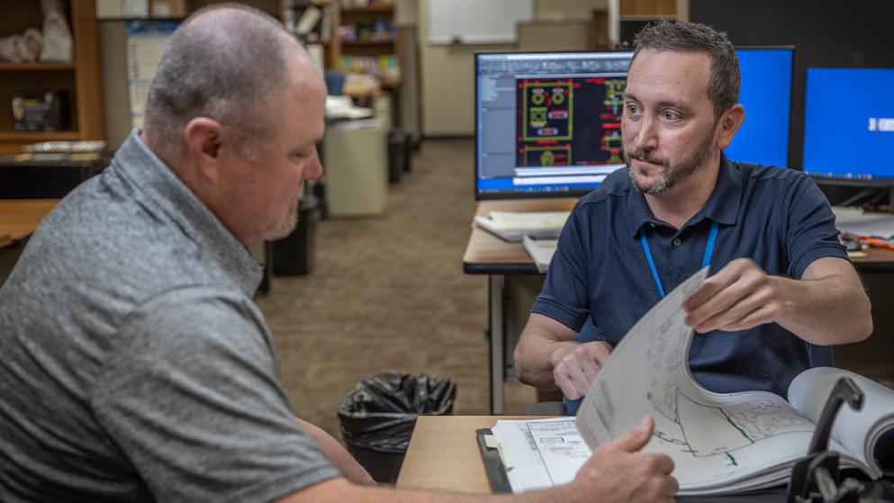 Engineers discussing early alignment for project success