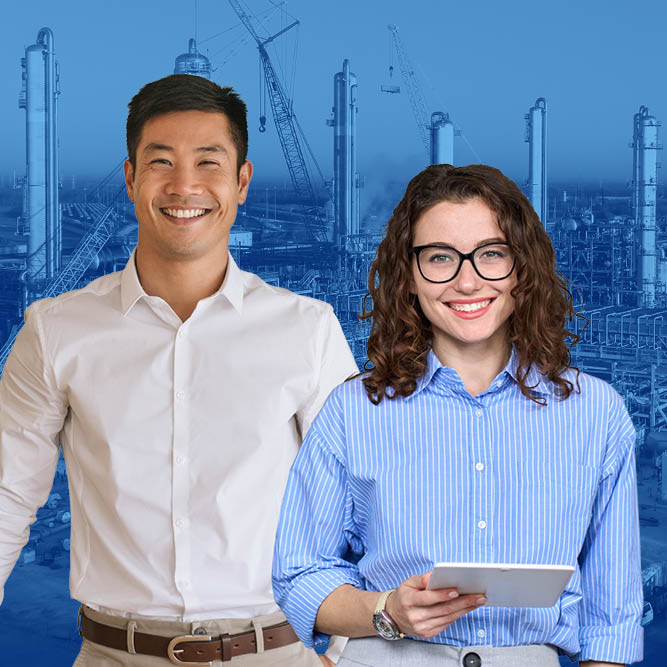 Two young professionals smiling at the camera holding hardhats