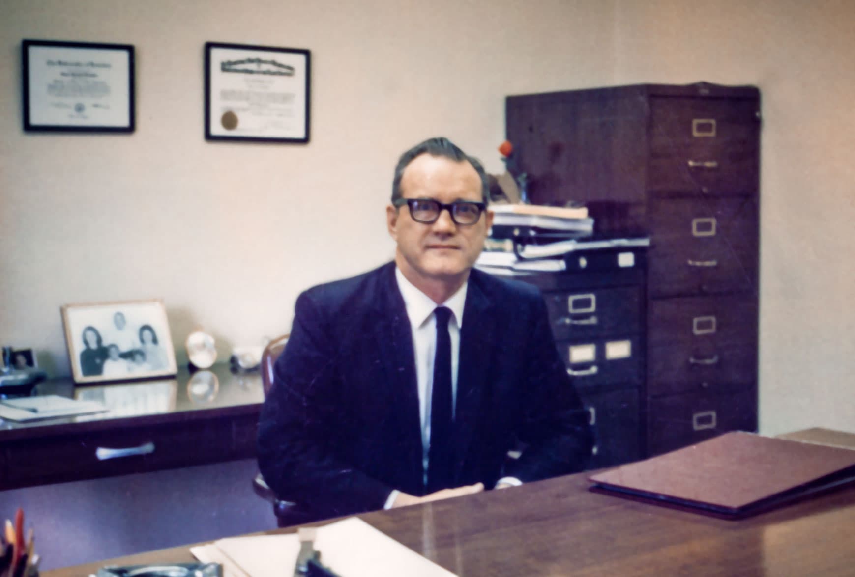 J.G. Slaughter Sr. sitting behind his desk