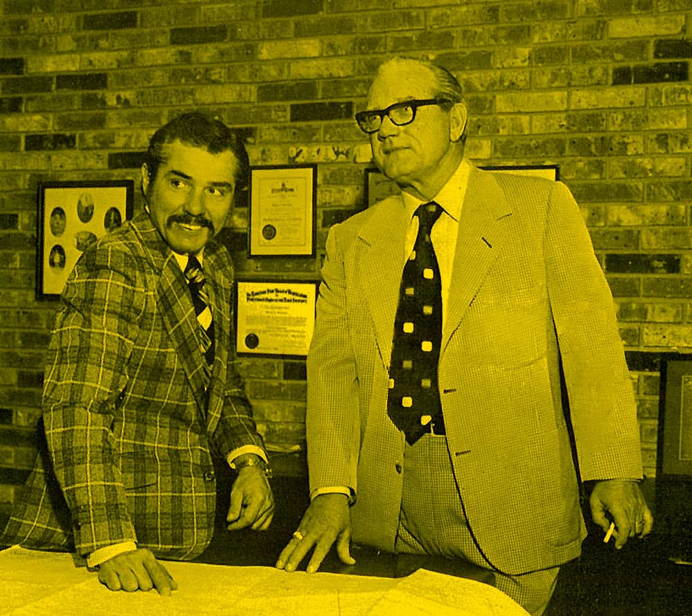 J.G. Slaughter Sr. and Bill Brookshire Sr. looking over a map together