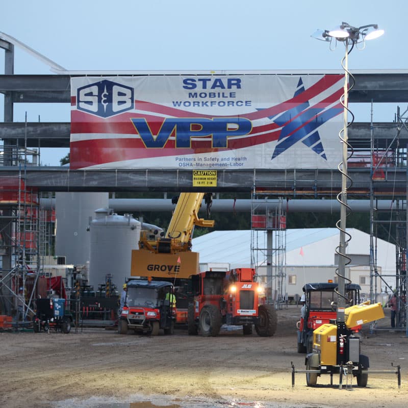 A Star Mobile Workforce VPP banner hanging off of scafolding at a work site