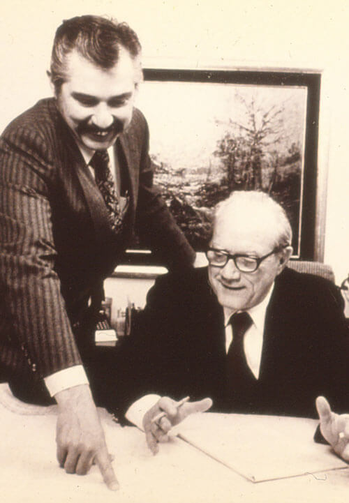 James G. Slaughter and Dr. William Brookshite looking over their first project together