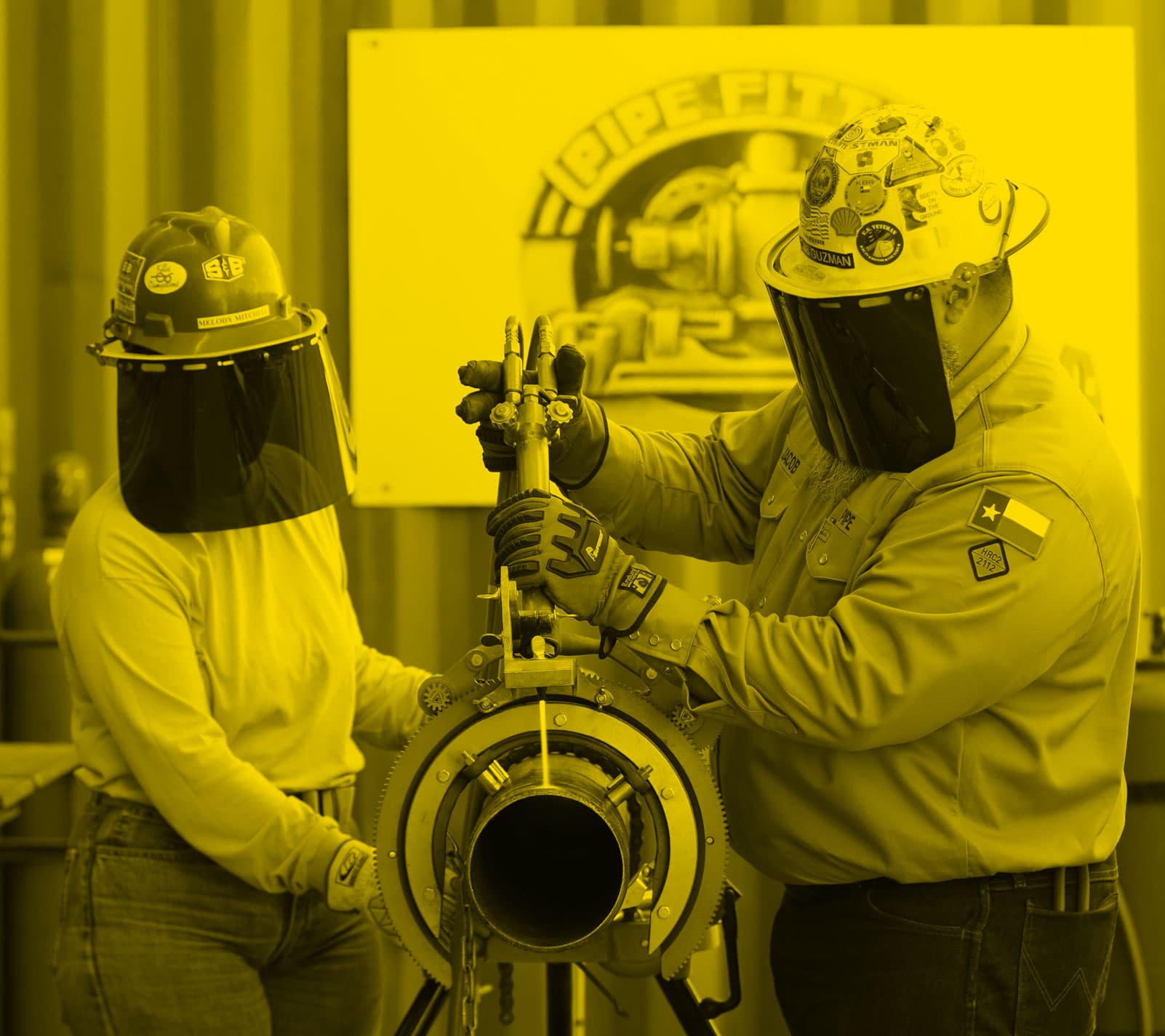 S&B crew members using a laser cutter on a pipe