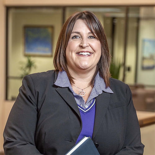 A professional woman inside an office building