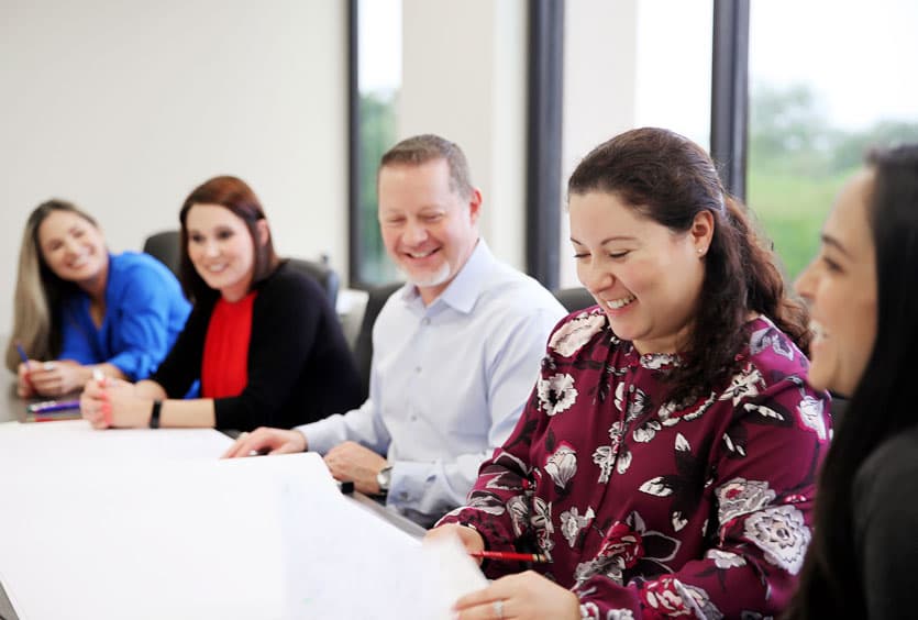 S&B teammates sitting around a conference table