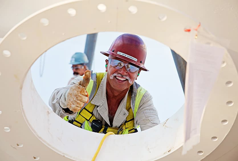 An S&B employee giving a thumbs up, ready to help with EPC services