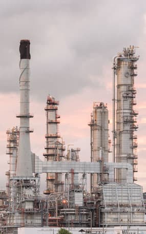 Chemical plant stacks at dawn