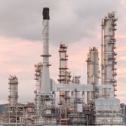 Chemical plant stacks at dawn