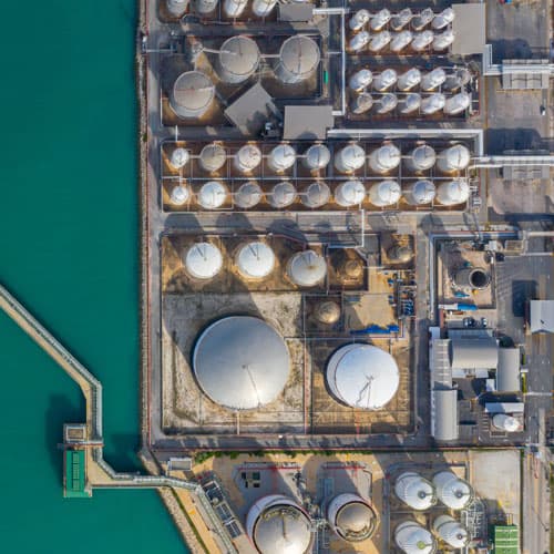 An aerial view of gas terminals by water