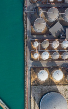 An aerial view of gas terminals by water