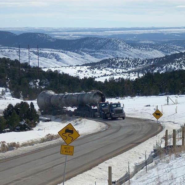 An eighteen-wheeler hauling equipment to the Meeker 2 Cryogenic Gas Processing Plant