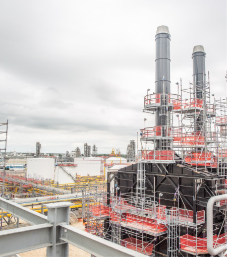 Railings lining infrastructure in a refinery